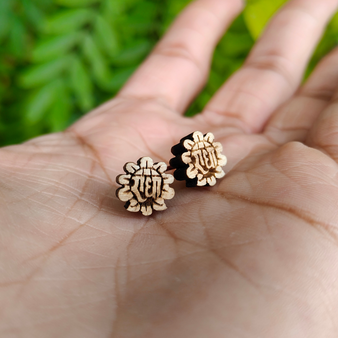 These Flower Shaped Radha Naam Tulsi earrings are lovingly handmade from real Tulsi wood. Each earring is carefully shaped like a flower and softly engraved with Radha Naam, giving it a simple, peaceful, and devotional feel. Tulsi has a natural warmth and light fragrance. When you wear these Tulsi earrings, they feel calm and comfortable—perfect for temple visits, bhajan, or daily wear. Many devotees like to pair them with a pure Tulsi mala from a trusted Tulsi store / Tulsi mala store, especially those connected to Vrindavan bhakti. Product details ✨ Made from pure Tulsi wood Flower design with Radha Naam Very light in weight, easy on ears Smooth, skin-friendly finish Ideal for daily wear, pooja, satsang